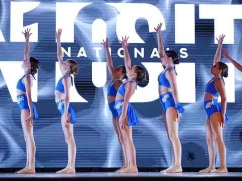 a group of women in blue uniforms