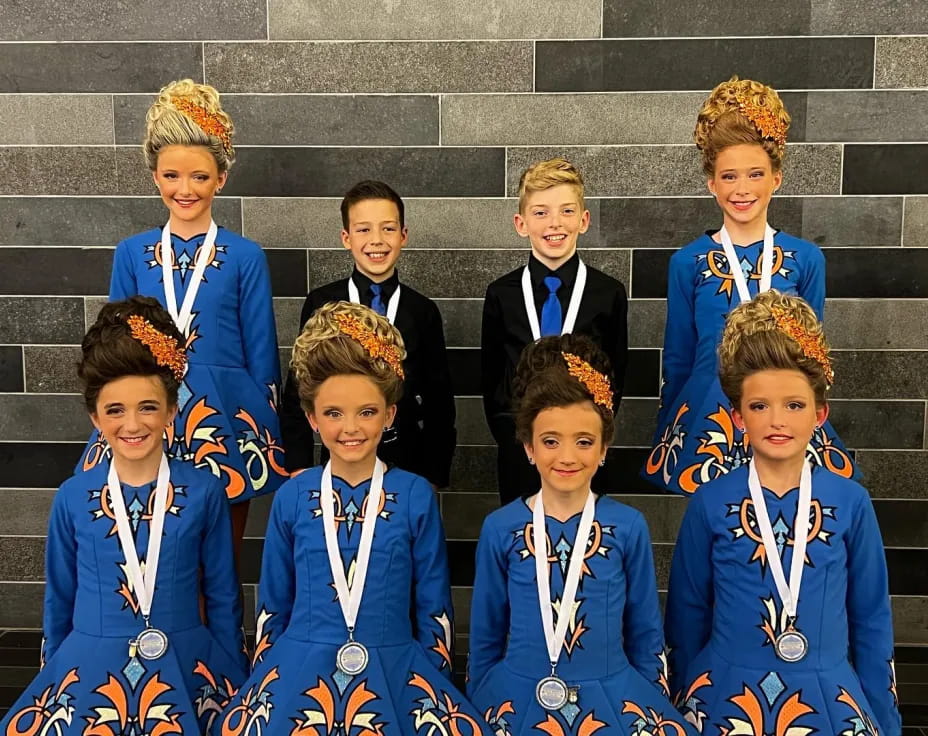 a group of boys in blue uniforms