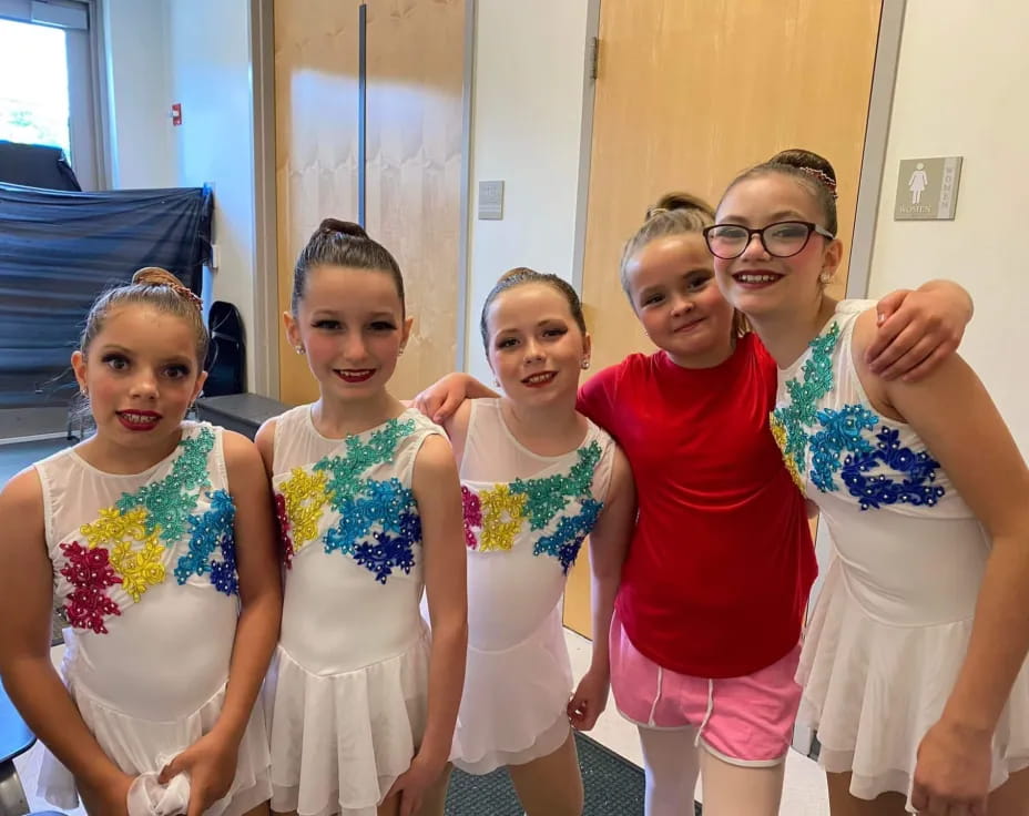 a group of girls posing for a photo