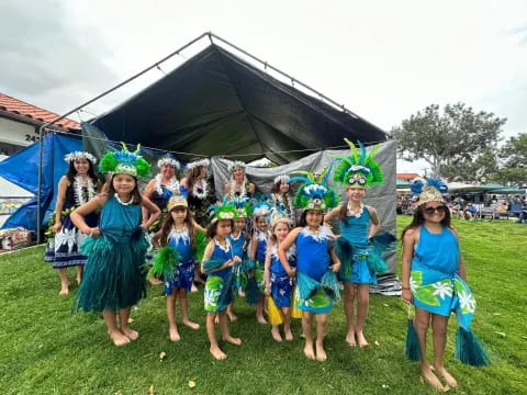 a group of girls in blue dresses