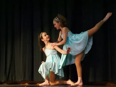 a couple of girls dancing