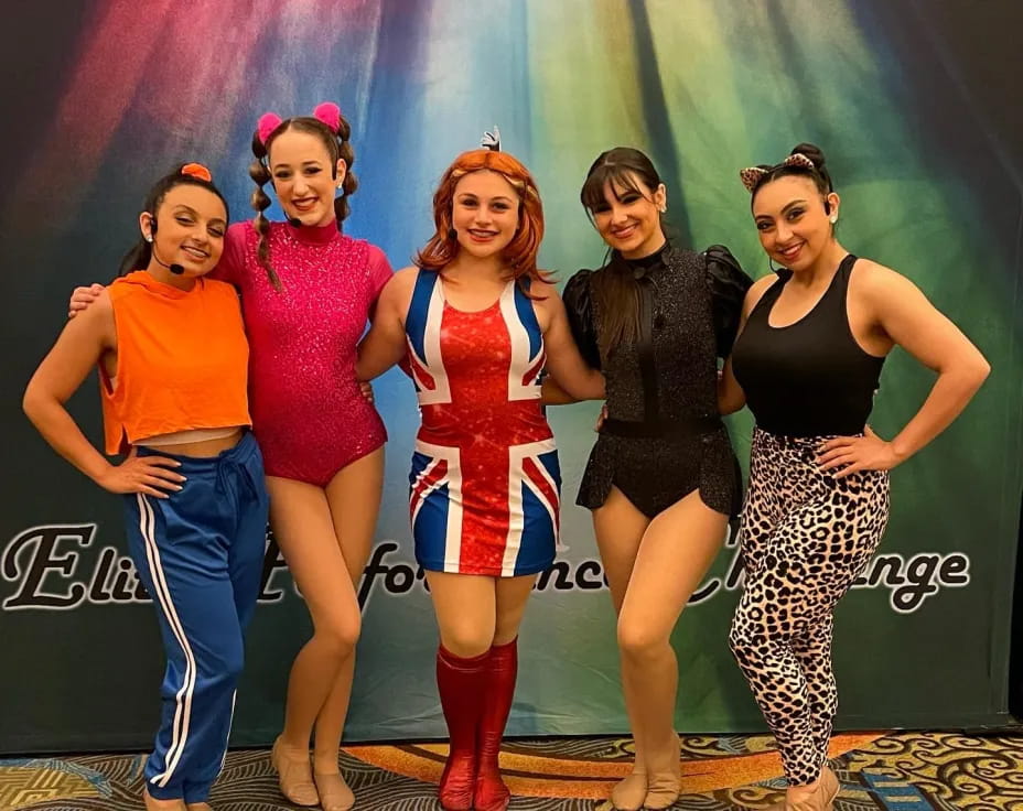 a group of women posing for a photo