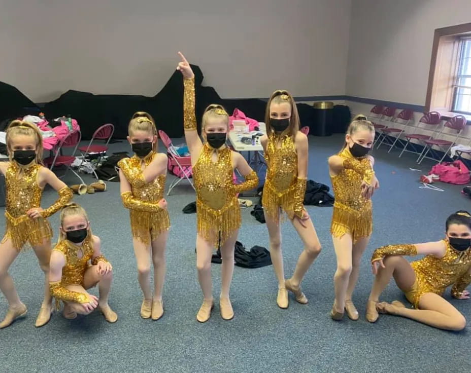 a group of girls wearing clothing