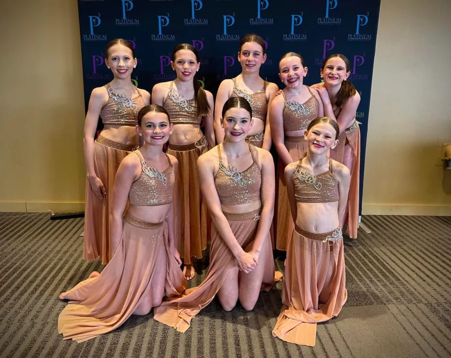 a group of women in dresses