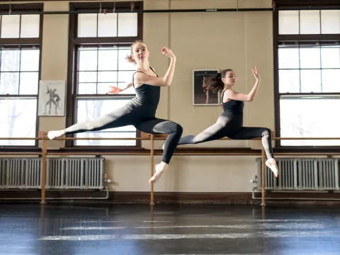 a couple of women dancing