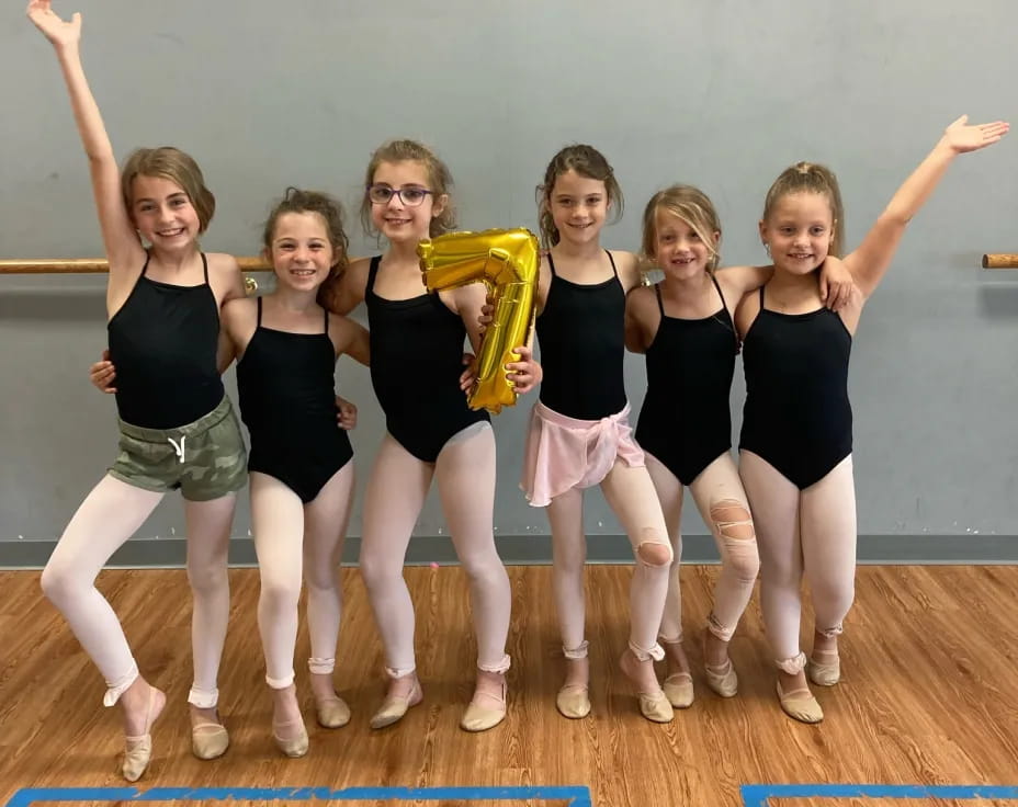 a group of women posing for a photo
