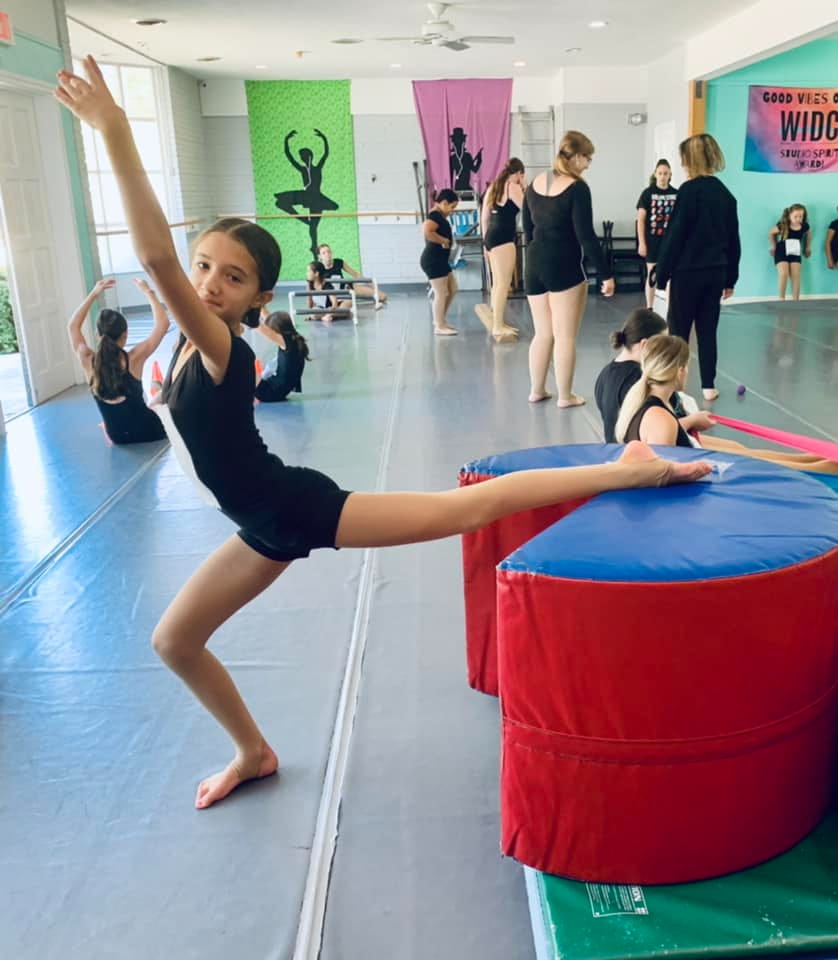 a woman doing a yoga pose