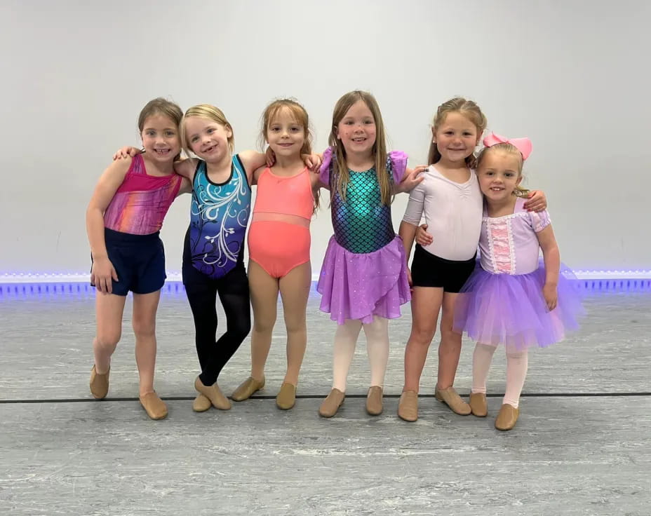a group of girls posing for a photo