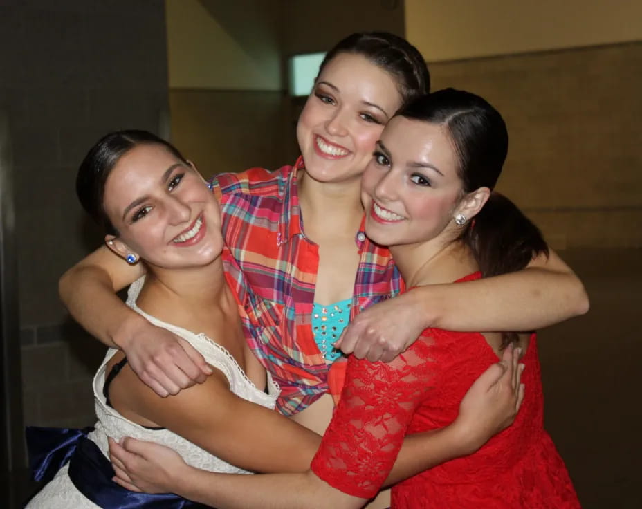 a group of women hugging