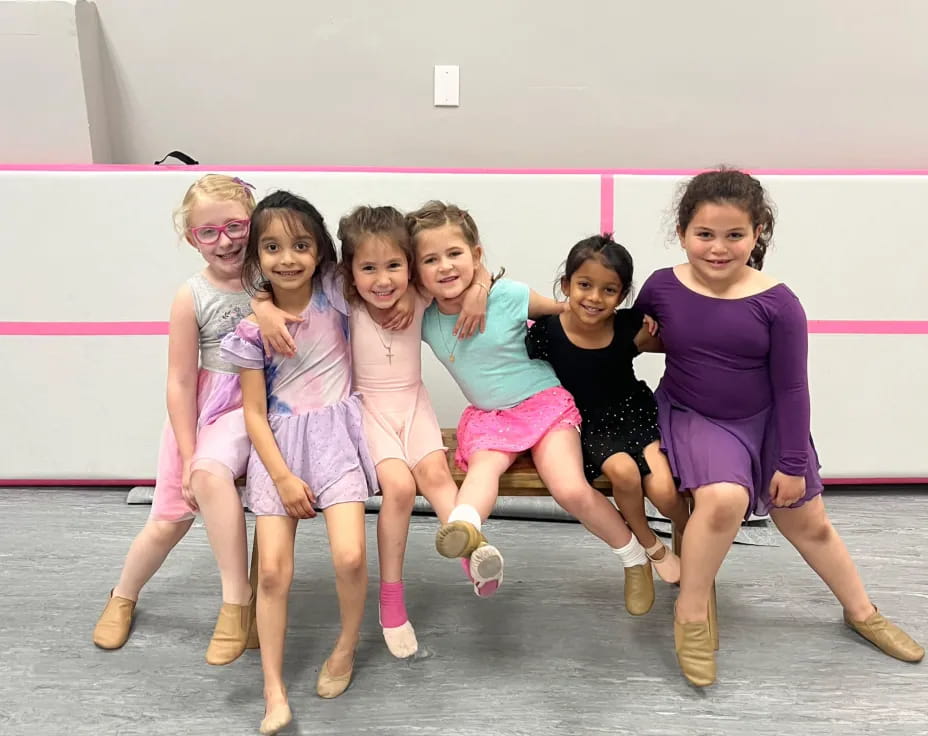 a group of girls posing for a photo