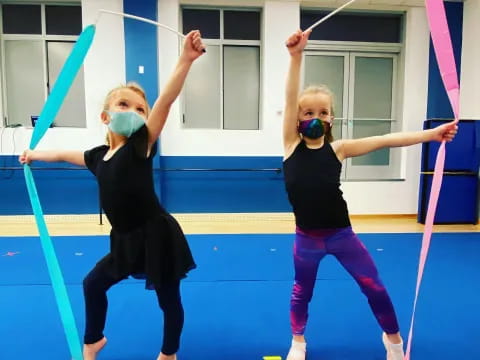 a couple of women in a gym