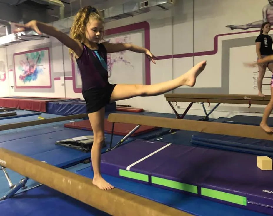 a woman doing gymnastics