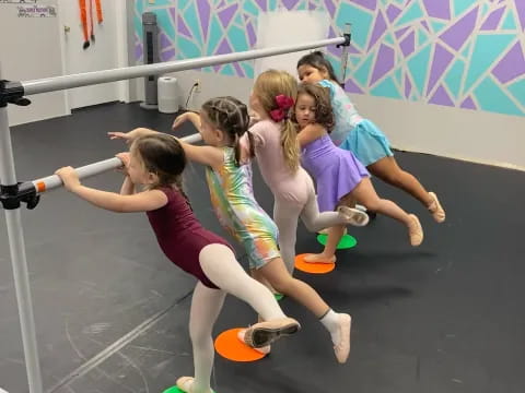 a group of girls doing yoga