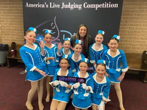 a group of girls in blue uniforms