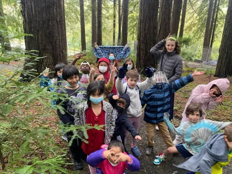 a group of children in the woods