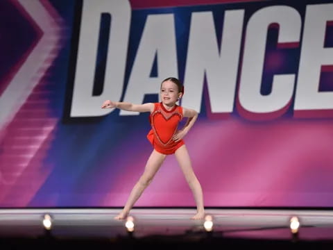 a woman dancing on a stage
