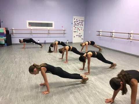 a group of people doing yoga
