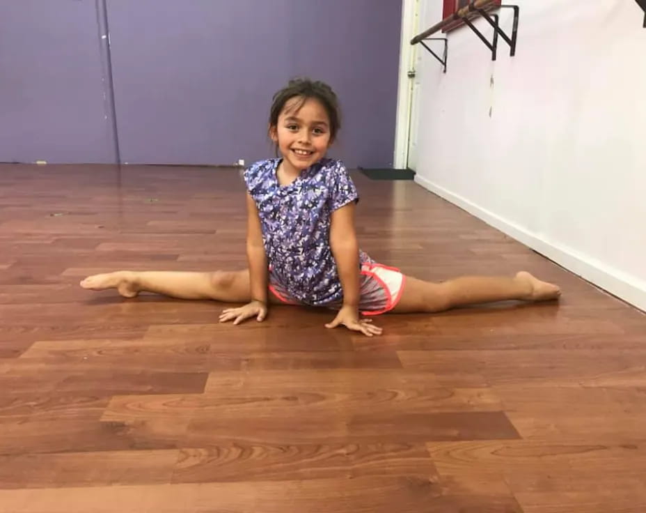 a girl sitting on the floor