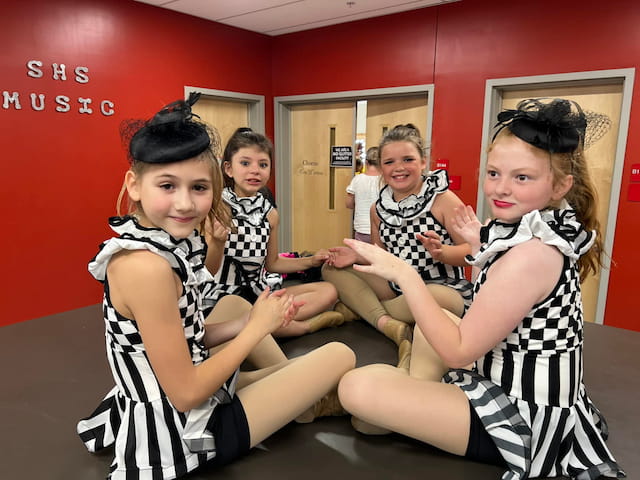 a group of girls sitting on a couch