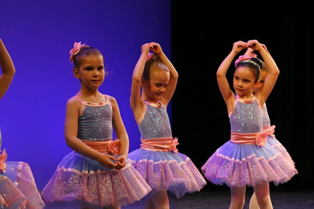 a group of girls in dresses