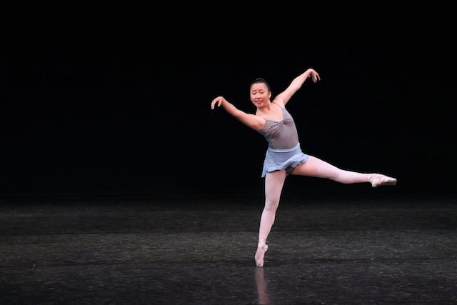 a woman dancing on a stage