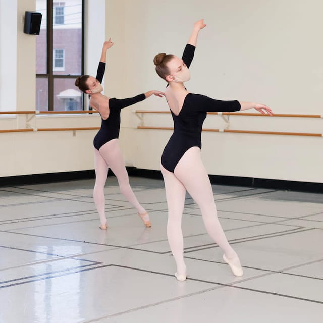 two women dancing on a stage