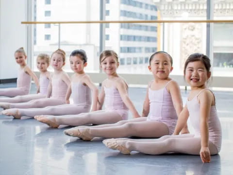 a group of women in white dresses