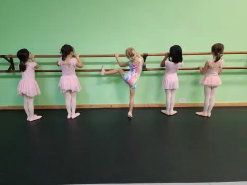 a group of girls in dresses