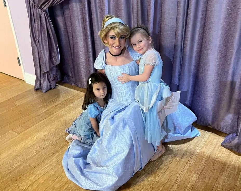 a group of girls in dresses