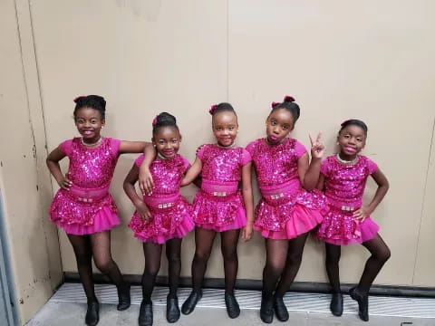 a group of women in dresses
