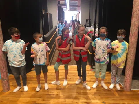 a group of children wearing masks