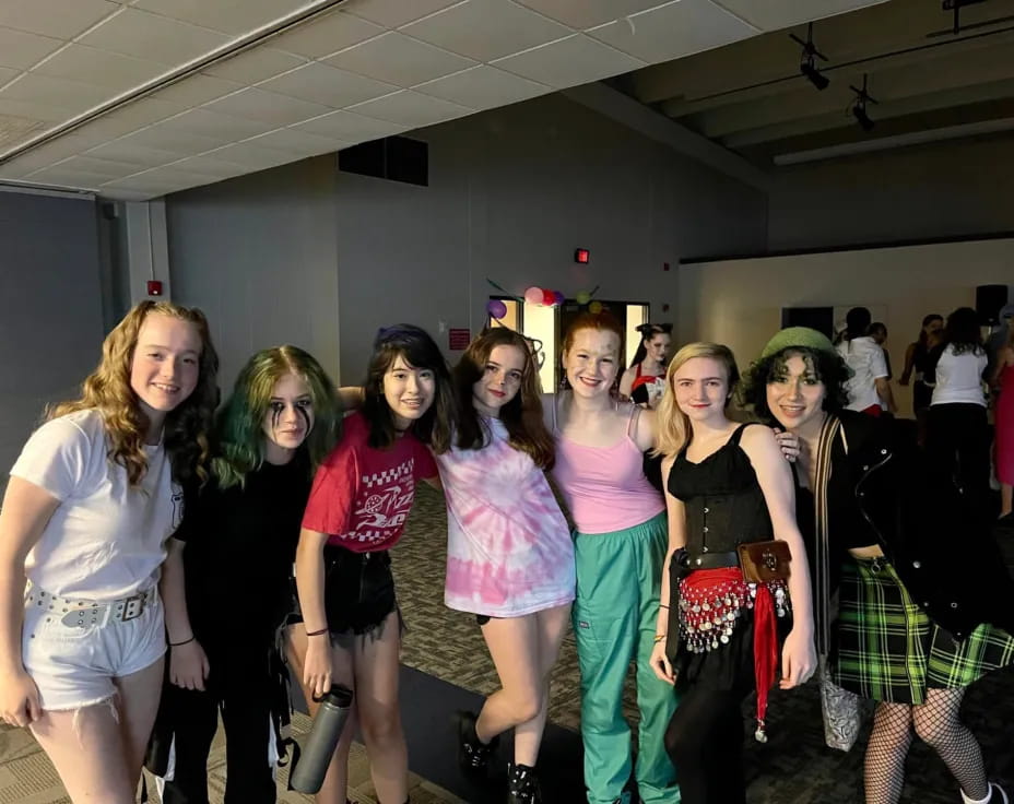 a group of women posing for a photo