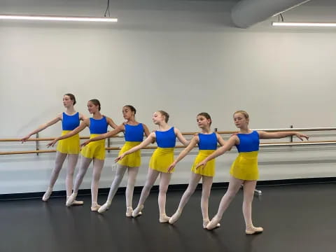 a group of women in blue uniforms