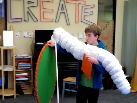a boy holding a kite
