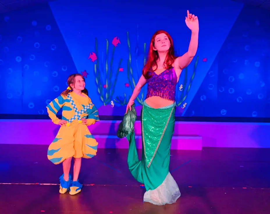 a couple of women on a stage