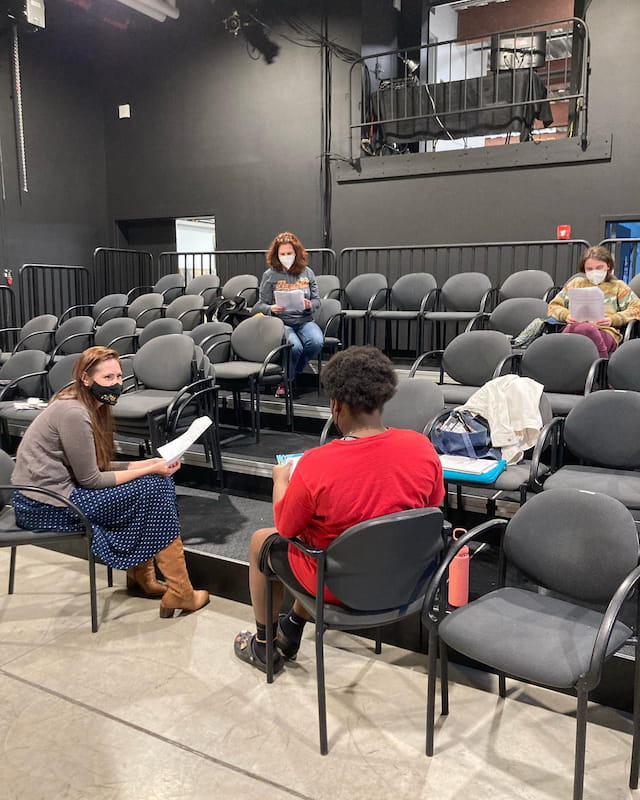 a group of people sitting in chairs