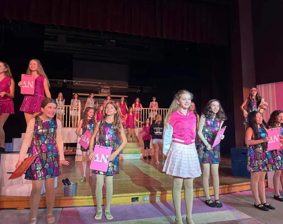 a group of girls on a stage