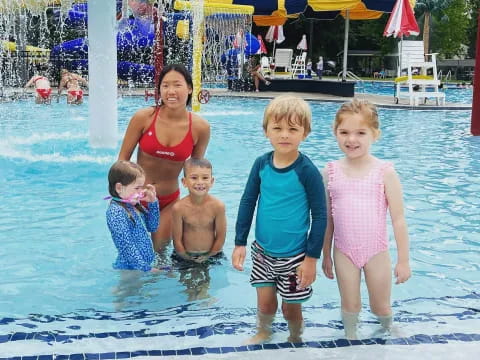 a group of children in a pool