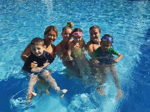 a group of kids in a pool