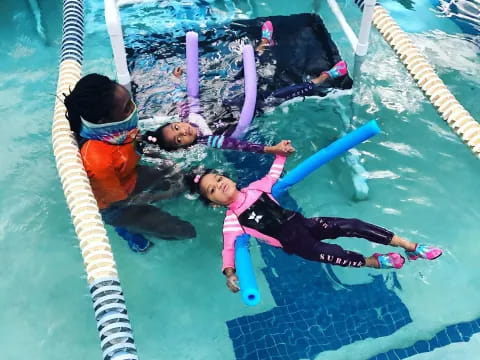 a group of kids on a swing