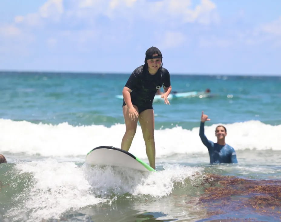 a man riding a surfboard