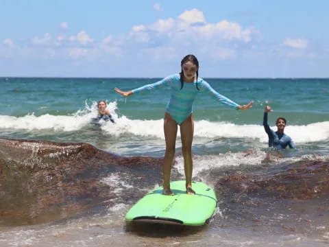 a woman on a surfboard in the ocean