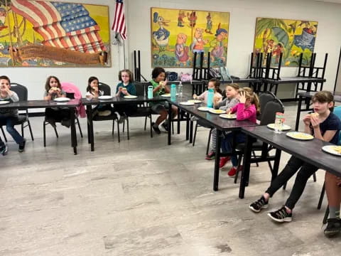 a group of people sitting at tables