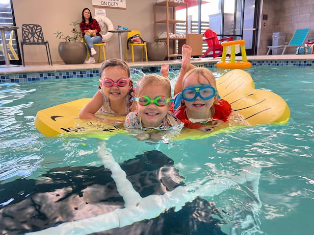 a group of kids in a pool