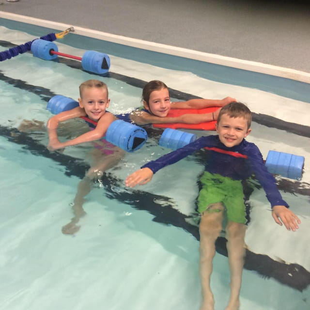 a group of kids in a pool