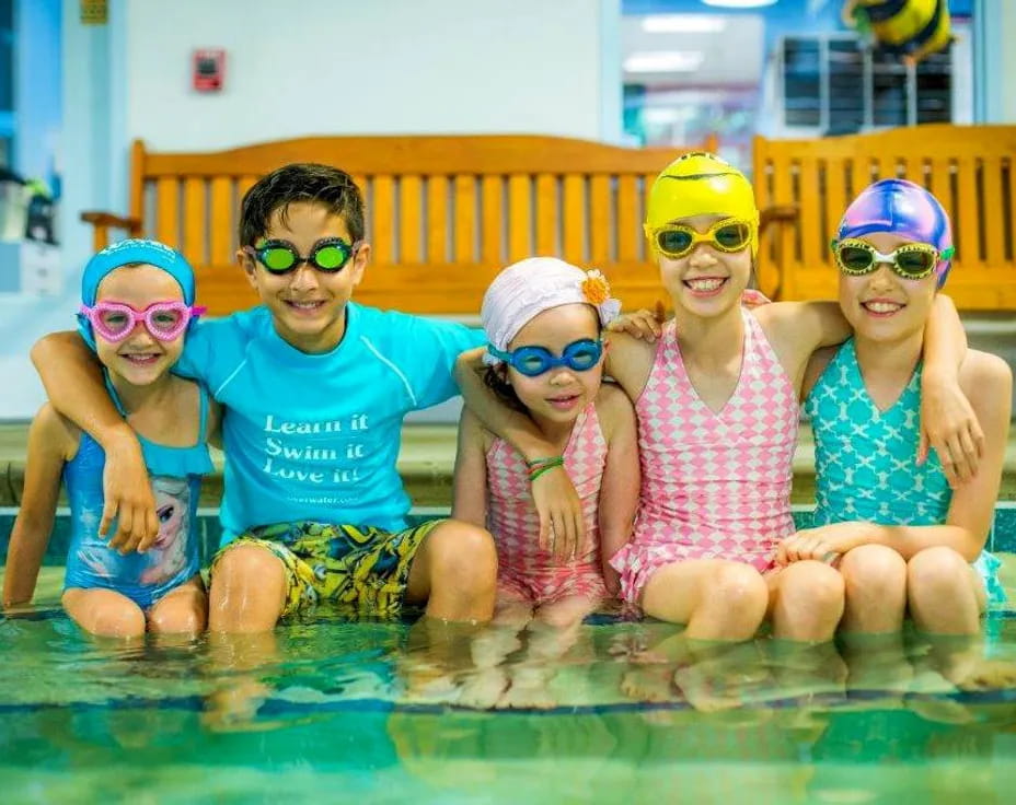 a group of kids in a pool