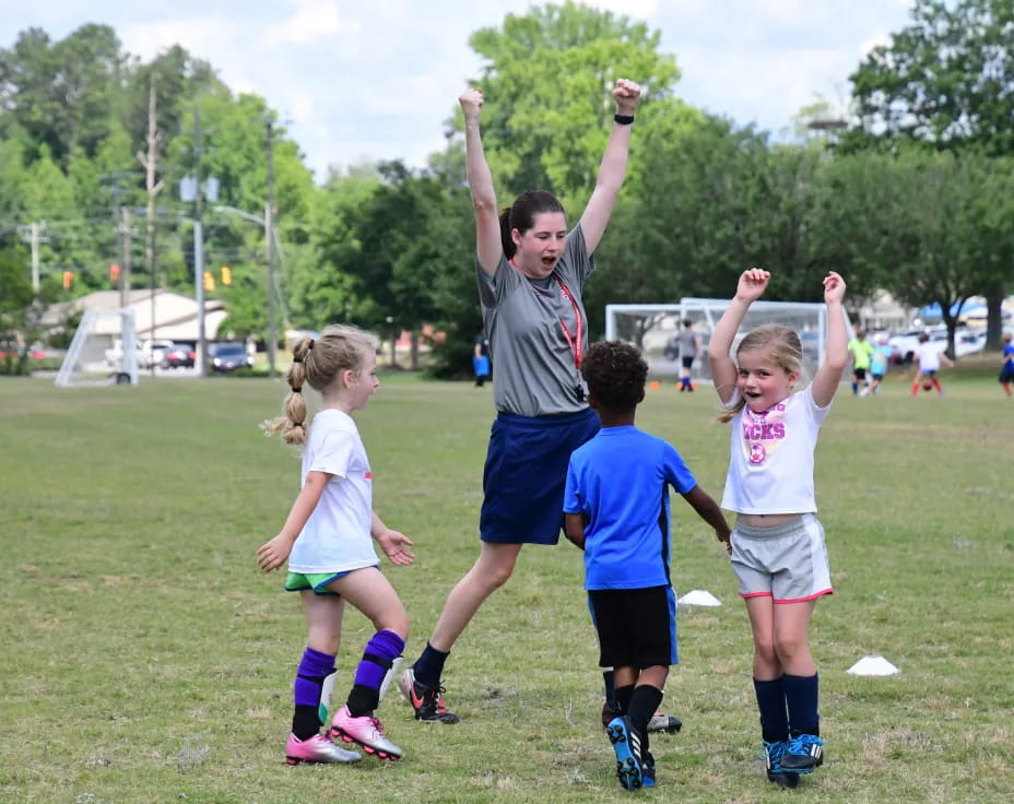 a group of kids playing football
