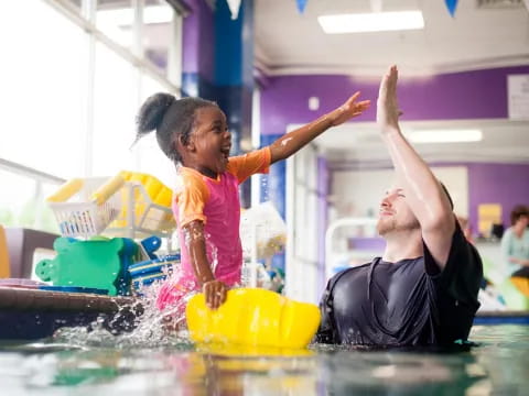 a man and a woman in a pool