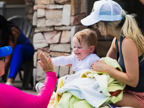 a woman holding a baby
