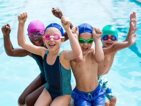 a group of kids in a pool